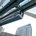 A modern monorail train passing through Chiba, Japan, showcasing urban infrastructure and transportation.